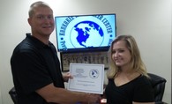 Karly Bainbridge, with Mr. Lucas Papineau. Karly receiving certificate for Positive Referral Winner